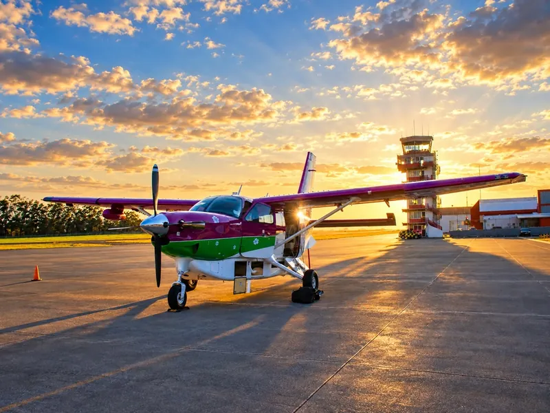 Costa Rica Green Airways aircraft on the apron at sunset