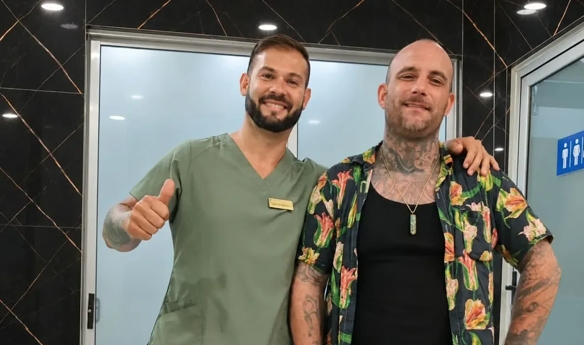 Happy Esthetic Dent patient with his dentist after a documented smile makeover case