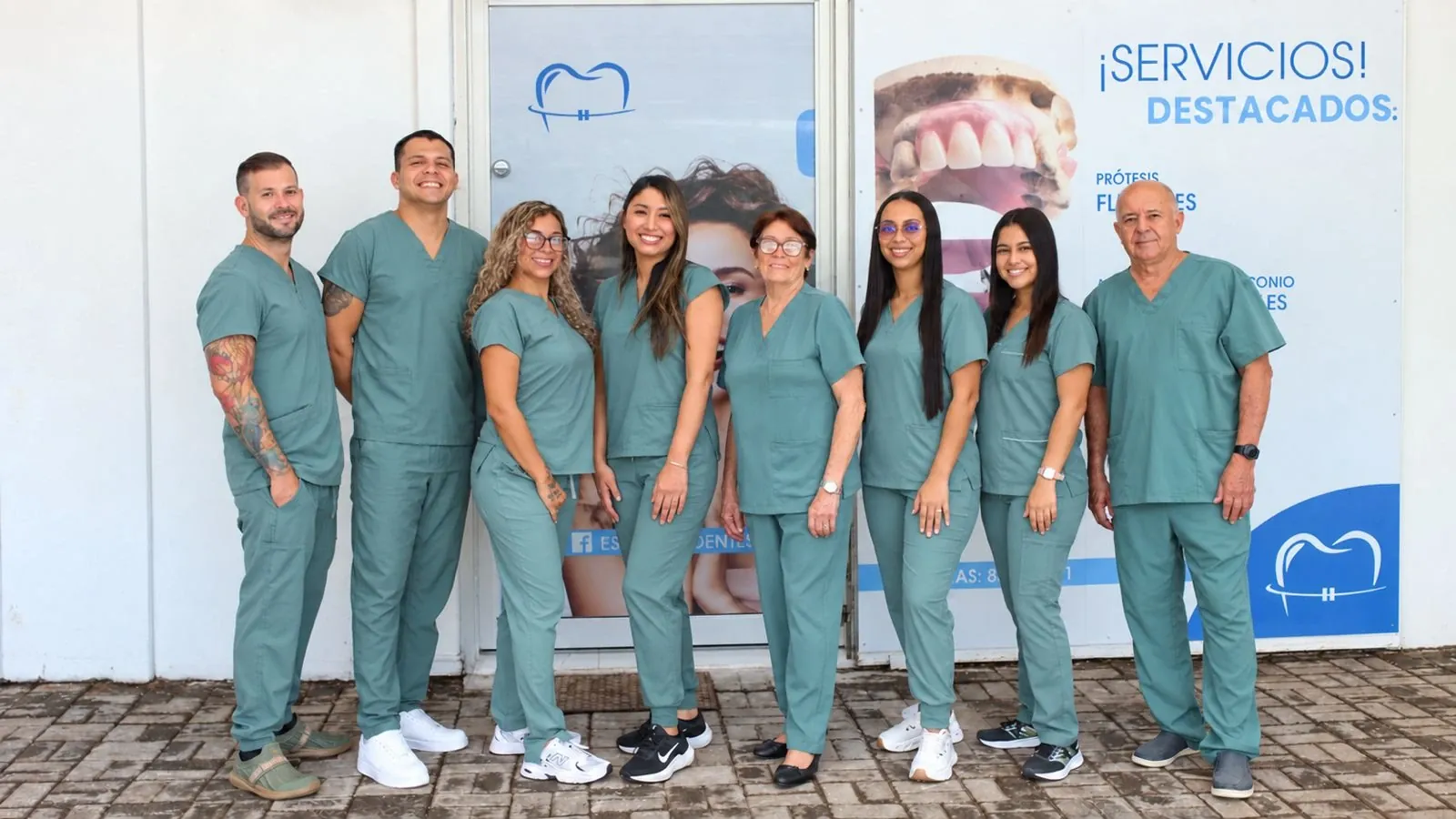 The Esthetic Dent team outside the clinic entrance